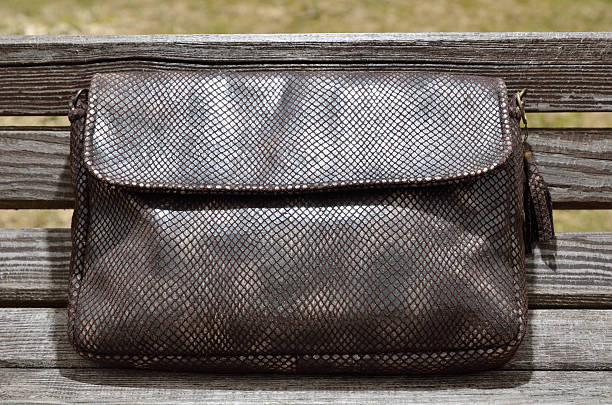 istock Female handbag on the bench 186210764
