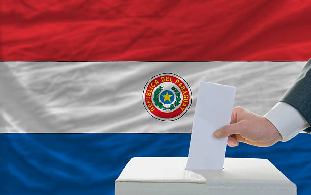 istock man voting on elections in paraguay  front of flag 186211181