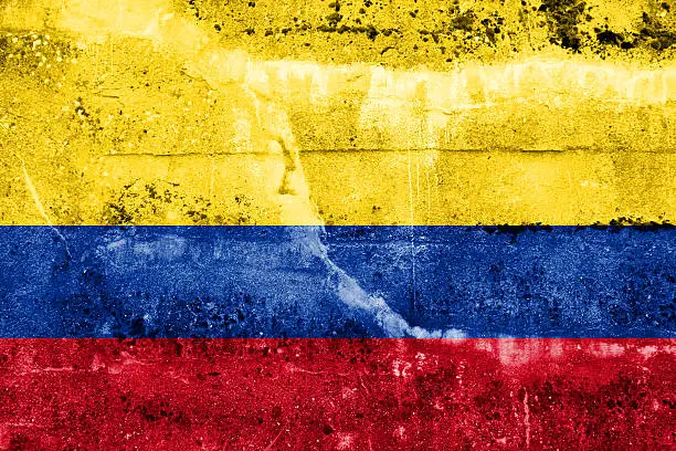 Photo of Colombia Flag painted on grunge wall