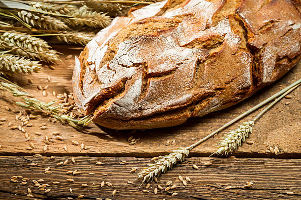 istock Loaf of bread in a rural bakery with wheat 186211709