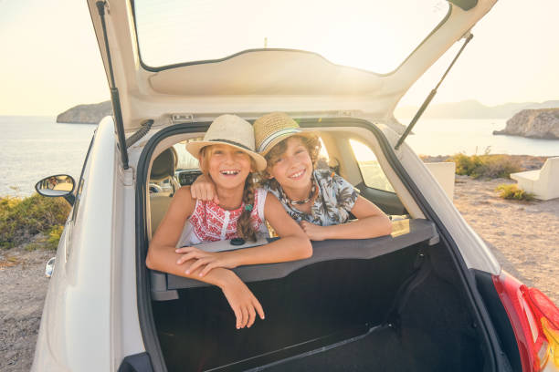istock Brother embracing his sister while is smiling and wearing straw 1862117789