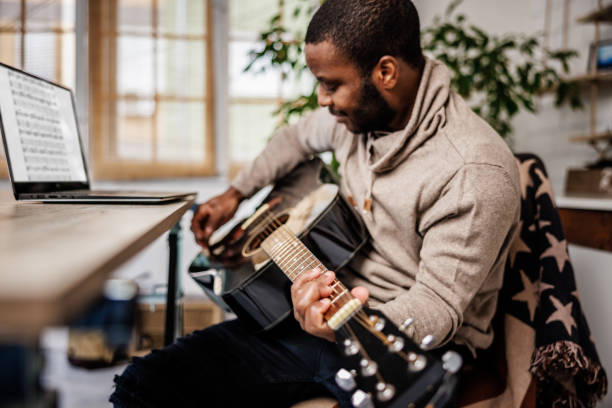 istock Professional guitarist composes music in home studio 1862132597