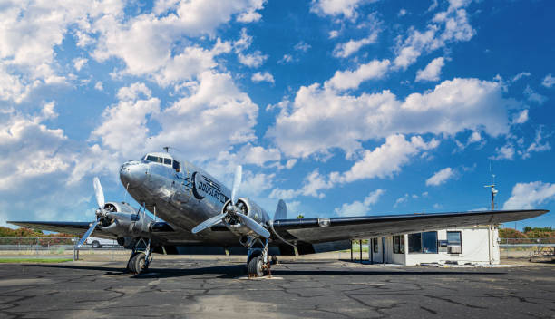 Old Douglas DC-3 airplane on the runway of the airfield in Lodi. History of the USA Lodi, California, USA - June 06, 2017: Vintage old transport propeller plane Douglas DC-3 at the airport in Lodi, California, USA. History of US aviation. Summer trip around the USA technology in the 1940s stock pictures, royalty-free photos & images