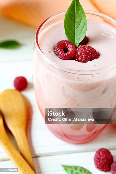 Raspberry Smoothie Milk In A Transparent Glass Stock Photo - Download Image Now - Backgrounds, Berry Fruit, Blended Drink