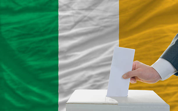 istock man voting on elections in ireland front of flag 186214752