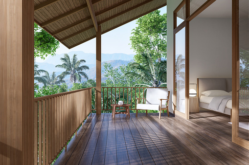 Modern contemporary terrace open the door to bedroom 3d render, there are wooden floor decorate with white fabric chair overlooking nature view.