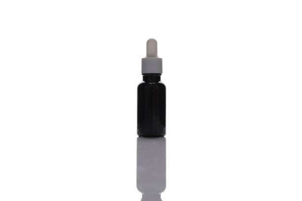 istock Tea-colored serum bottle on a white background. 1862150378