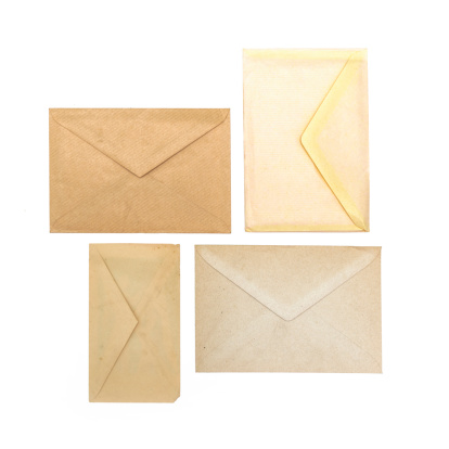 collection of various envelopes and letters on white background. each one is shot separately