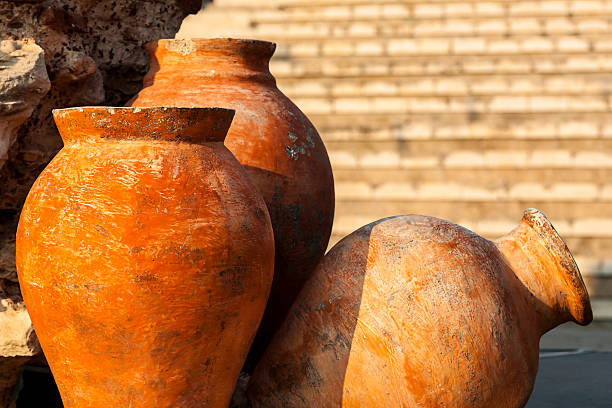 istock Terracotta, a clay amphora, stone wall in the background 186215326