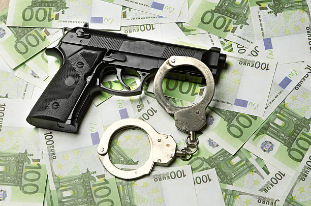 istock Image of the old gun and money 186217213