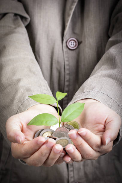 istock Businessman cover growing plant 186217606