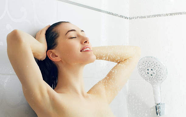 istock girl at the shower 186217656