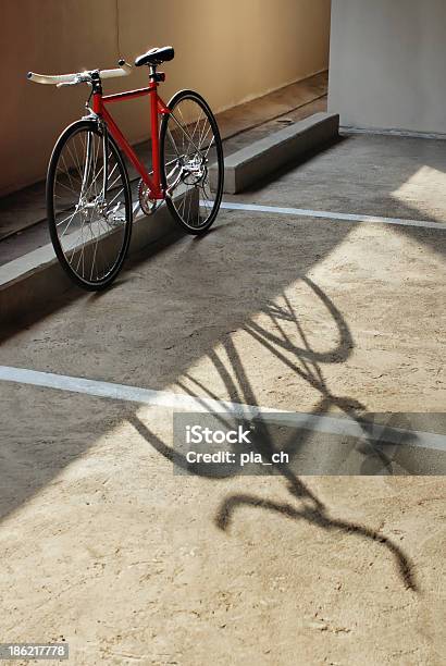 Red Bicycle And Its Shadow Stock Photo - Download Image Now - Bicycle, City, Concrete