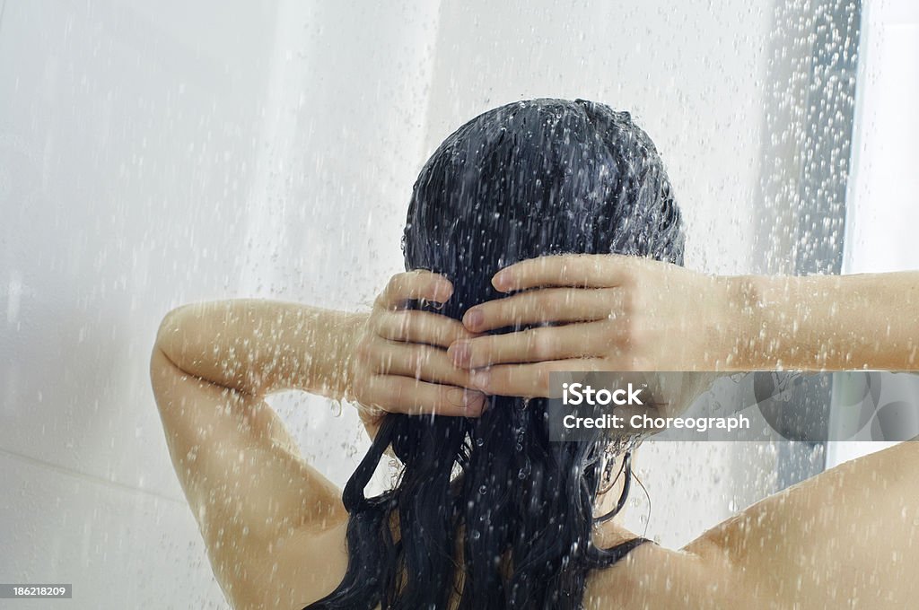 girl at the shower a beautiful girl standing at the shower Shower Stock Photo