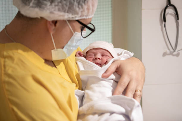 istock Father holding his newborn daughter for the first time 1862189260