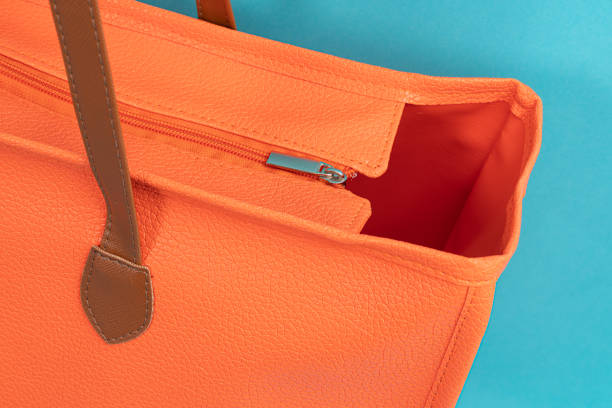 istock orange shopping bag, cyan background 1862191868
