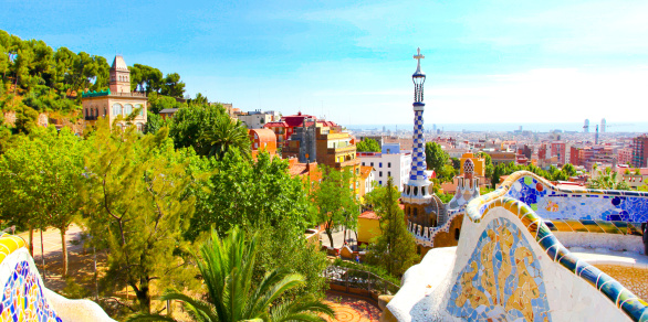 The Famous Summer Park Guell over bright blue sky in Barcelona, Spain