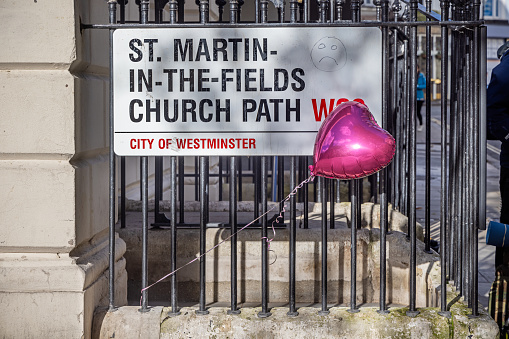 Adelaide Street, London, England - November 6th 2023:  Heart shaped balloon tied to a fence outside St. Martin in the fields church
