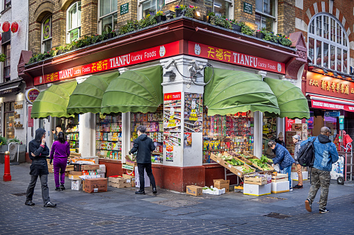 Macclesfield Street, London, England - November 6th 2023:  Greengrocers shop on a street corner in London's Chinatown