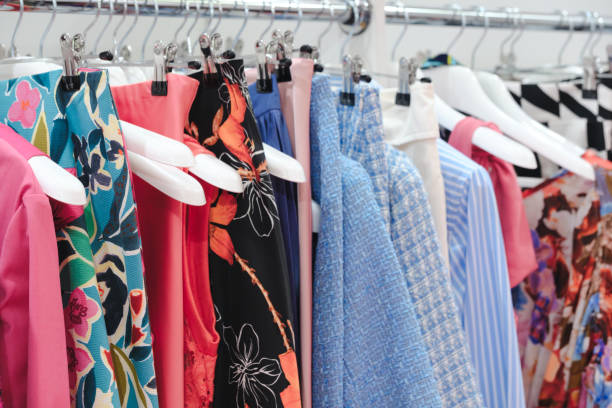 istock Multicolor family clothes on hangers in store 1862203971