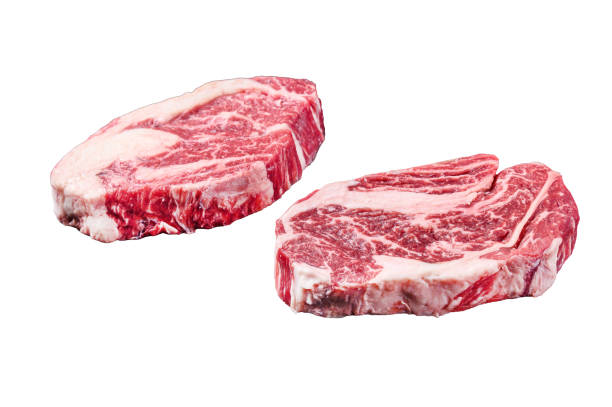 istock Raw chuck eye roll steaks, premium beef meat on a butcher board.  Isolated on white background. 1862205528