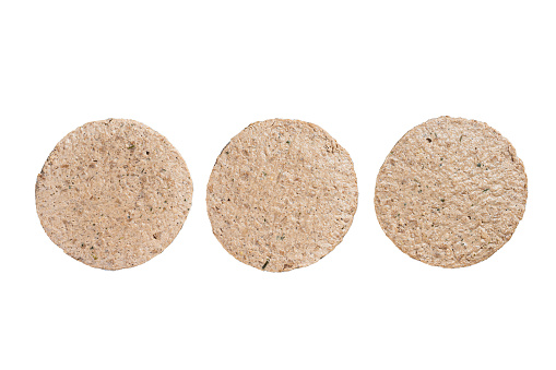 Raw Meat Free Plant Based Burger patties, vegetarian cutlets.  Isolated on white background