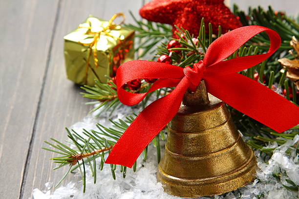 istock Golden bell with red satin ribbon bow 186220696