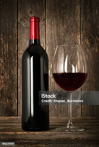 Bottle Of Red Wine And Glass Stock Photo - Download Image Now - Alcohol - Drink, Anniversary, Black Color