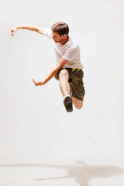 istock male dancer jumping in the air 186221624