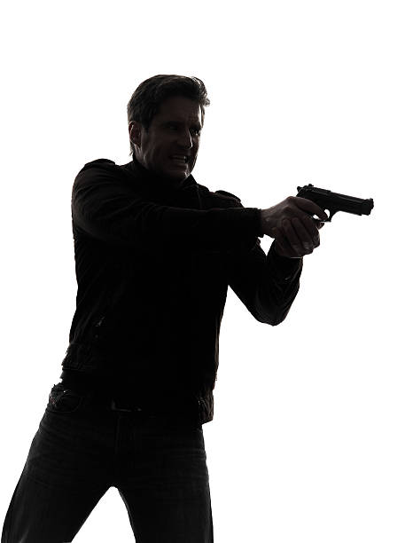istock man killer policeman aiming  gun portrait silhouette 186222630