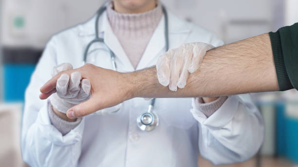 istock young orthopedist holds patient right arm 1862226333