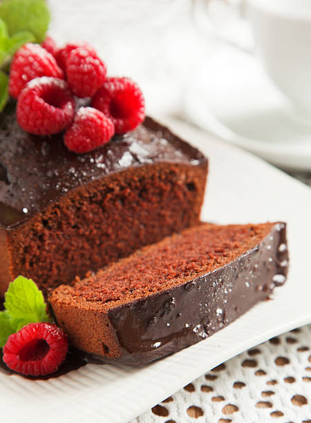 istock Chocolate loaf cake with frosting and raspberry 186223223