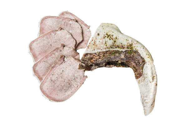 istock Sliced boiled beef tongue with herbs.  Isolated on white background. 1862238975