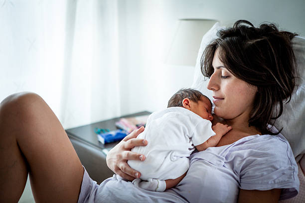 istock A mother with her baby boy sleeping on her chest 186224083