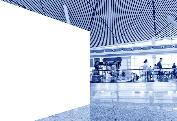 istock Airport passengers and blank billboard 186225717
