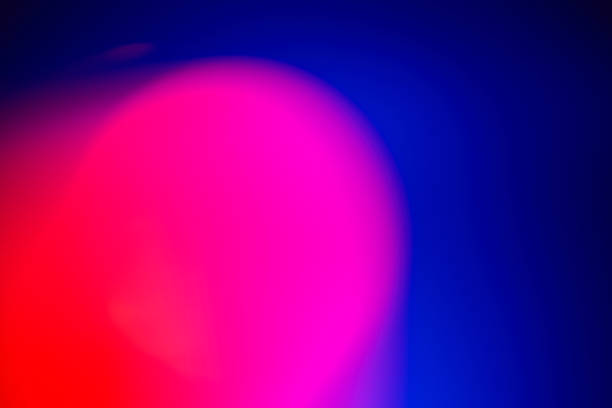istock Abstract defocused lens red and pink light leak on blue background 1862259730