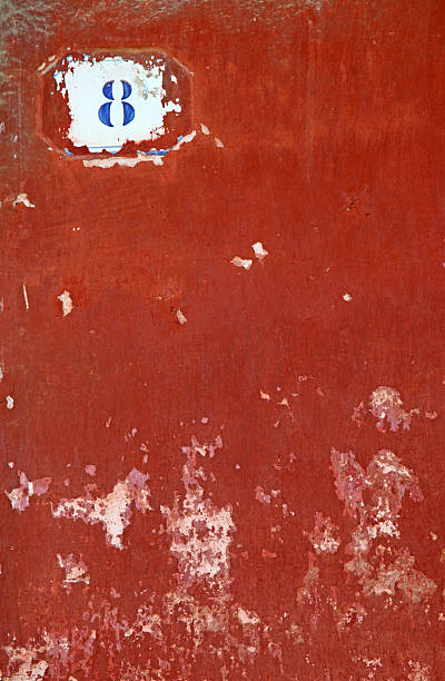 istock Blue number eight painted on brown weather worned background 186226696