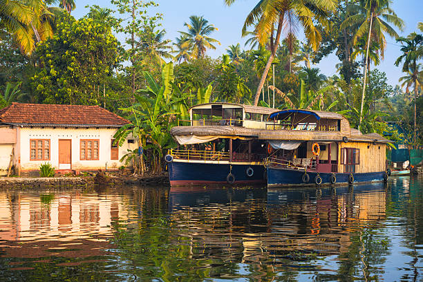 istock reflection houseboat and house in kerala backwaters, India 186226869