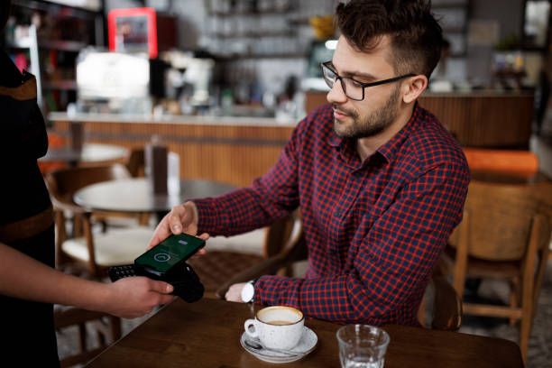 istock Young man paying for order at a cafe 1862277857