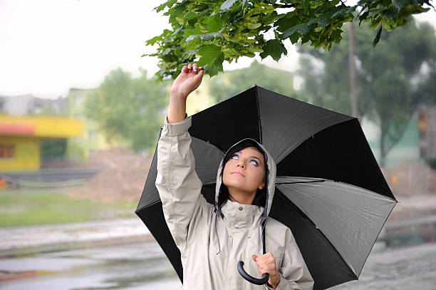 istock Young woman with an umbrella 186229032