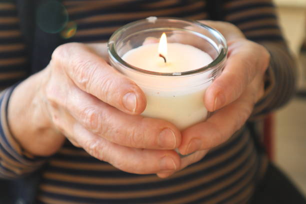 istock Woman holding candle. Christmas ceremony. 1862298439