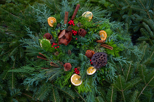 Christmas and holiday wreath with greens and dried fruit