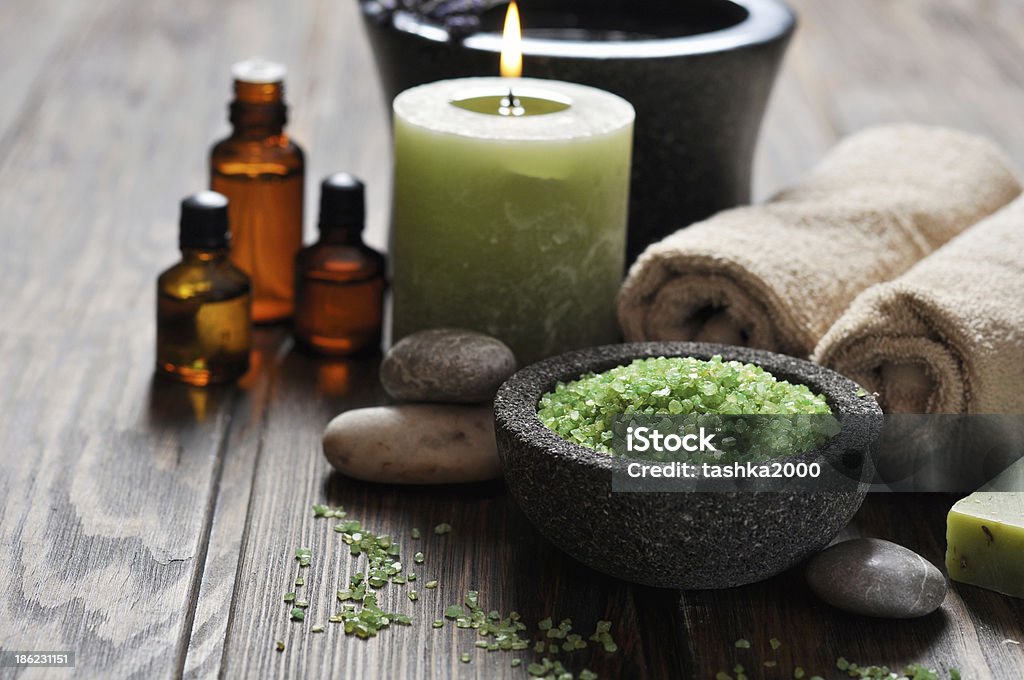 Spa concept Spa concept. Sea salt in stone bowl with candle and herbal soap Aromatherapy Stock Photo