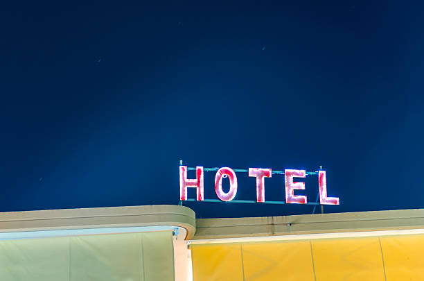 istock Hotel neon light sign on night star sky 186231286