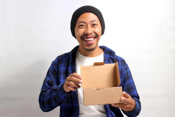 istock Asian man unpacks the cardboard parcel package 1862314541