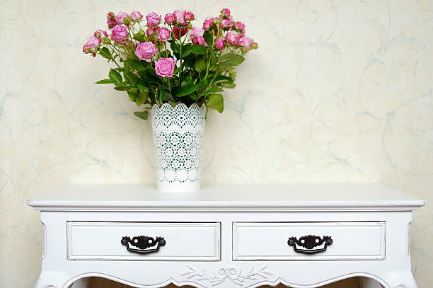 Roses flowers bouquet in vase on table empty copy  space background.