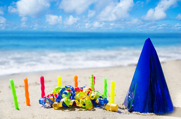 istock Candles with Birthday decorations on the beach 186232569