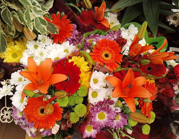 Flower Bouquet This beautiful bouquet has so may colours and blooms of all shapes and sizes. They balance each other with varying textures and shades in all variations red tiger lily stock pictures, royalty-free photos & images