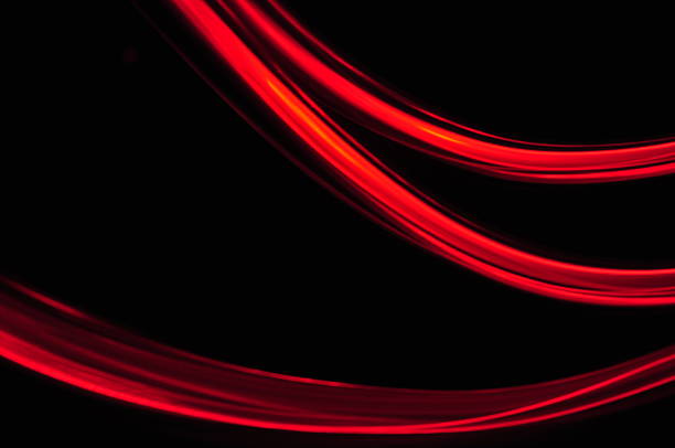 istock red orange lines trace on black background 186233053