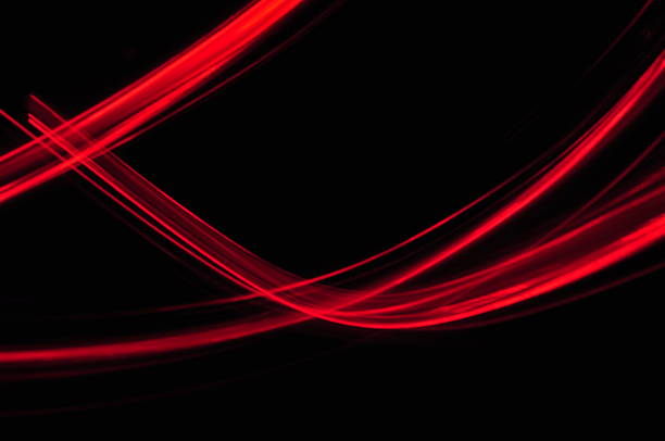 istock red orange lines trace on black background 186233054